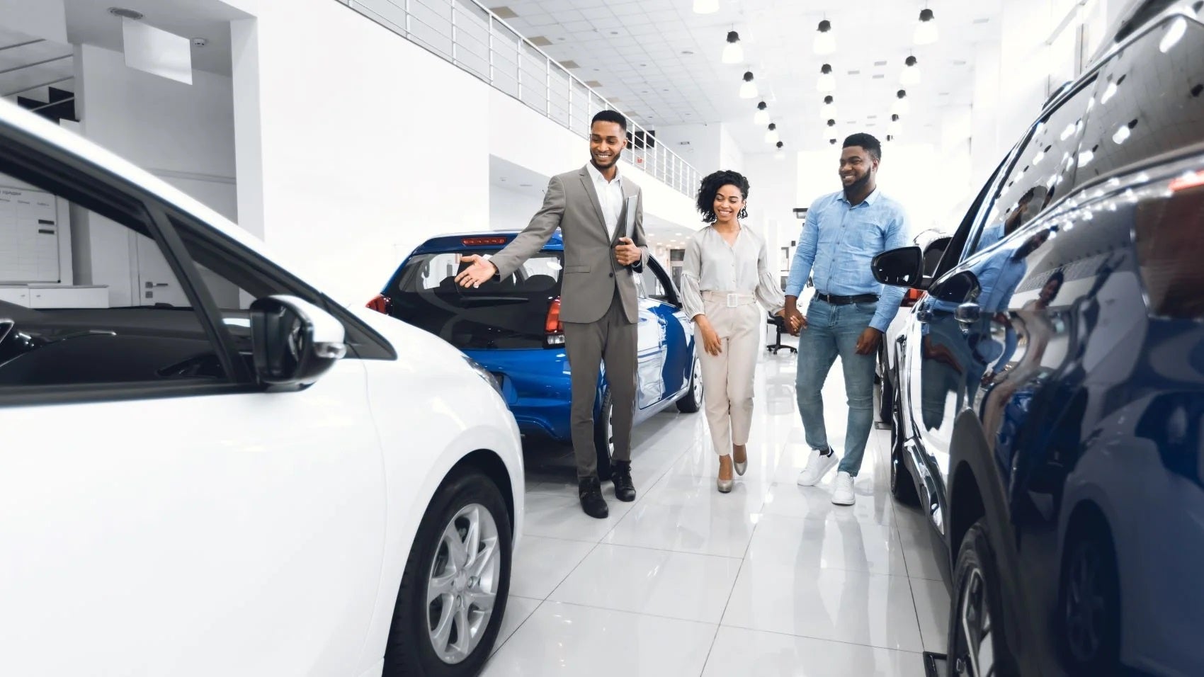 Ford Salesman Showing Vehicles to a Couple