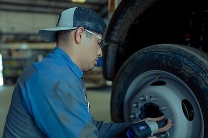 Service Technician Changing Tire