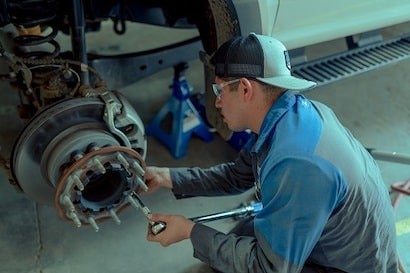 Service Technician Changing Tire