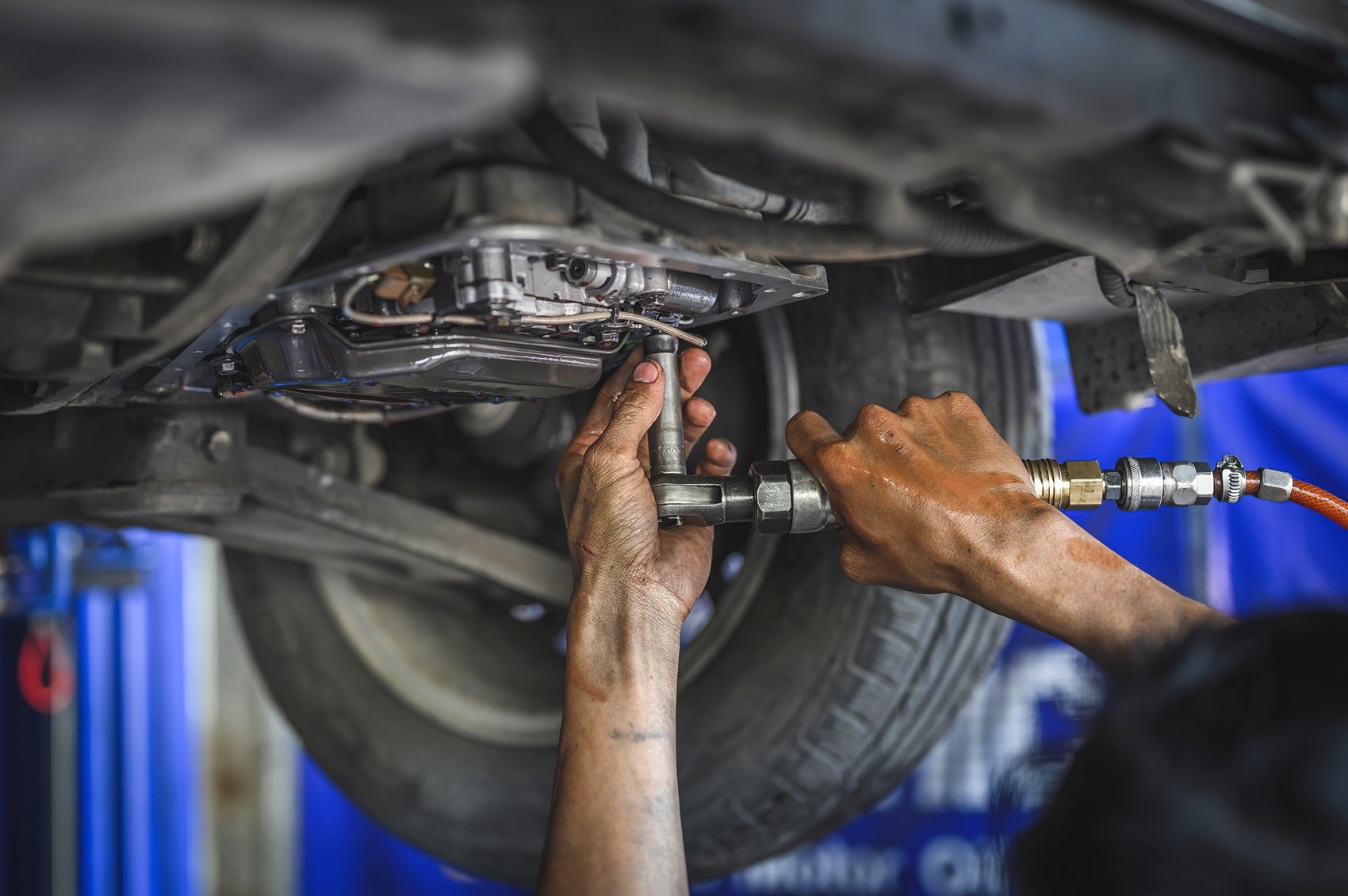 Service Technician Working on a Ford Vehicle